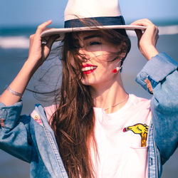 Midsection of woman wearing hat