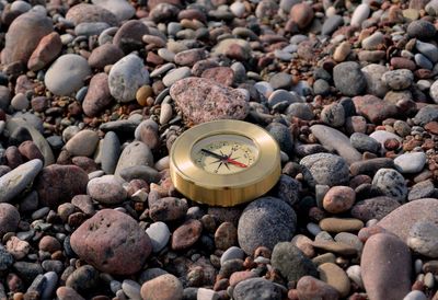 Close-up of text on pebbles at sea shore