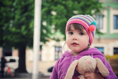 Portrait of cute girl with toy