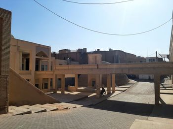 Buildings in city against clear sky