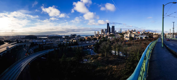 High angle view of city street and buildings against sky