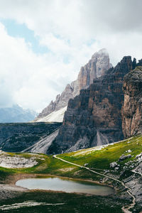 Scenic view of mountain against cloudy sky