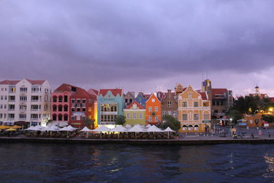 Houses in city against sky