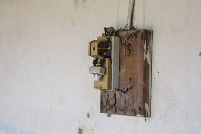 Damage, old circuit breaker on the wall