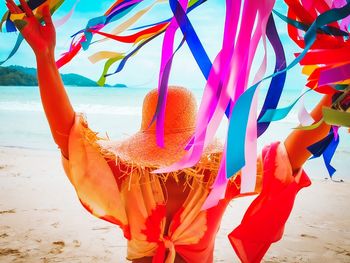 Low angle view of multi colored umbrella on beach