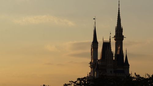 Silhouette of building against sky during sunset