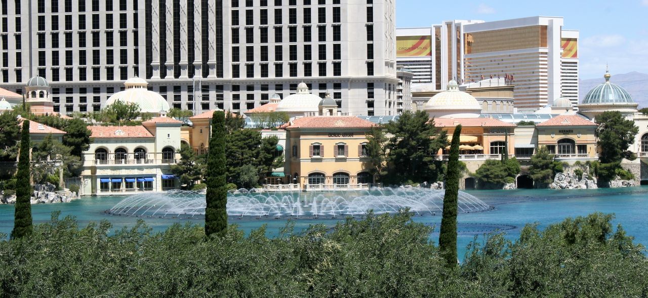 VIEW OF SWIMMING POOL IN FRONT OF BUILDINGS