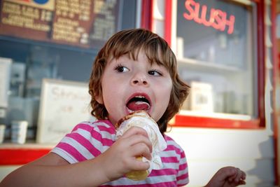 Close-up of child holding ice cream