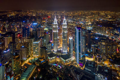 Aerial view of illuminated city at night