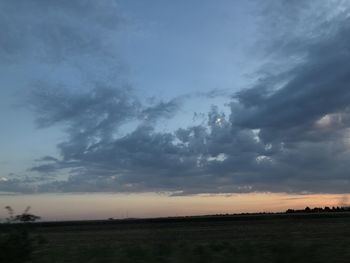 Scenic view of silhouette land against sky during sunset