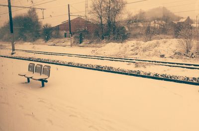 Scenic view of landscape against sky during winter