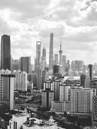 Modern buildings in city against sky