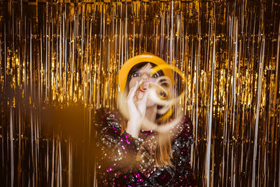 Portrait of young woman enjoying in party