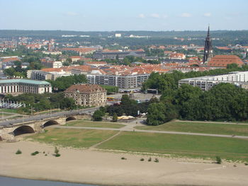 High angle view of buildings in city against sky