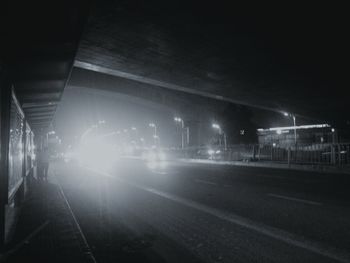 View of illuminated road at night