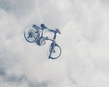 High angle view of bicycle parked on snow