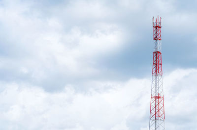 Low angle view of communications tower against sky