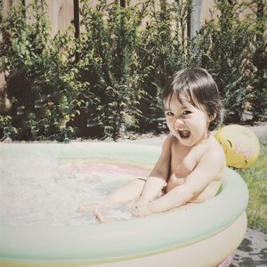 Portrait of smiling boy in swimming pool