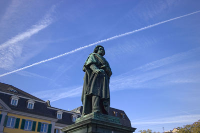 Low angle view of beethoven statue against sky