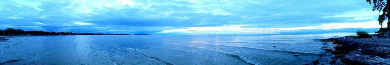 View of calm sea against cloudy sky