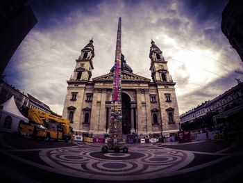 City street against cloudy sky