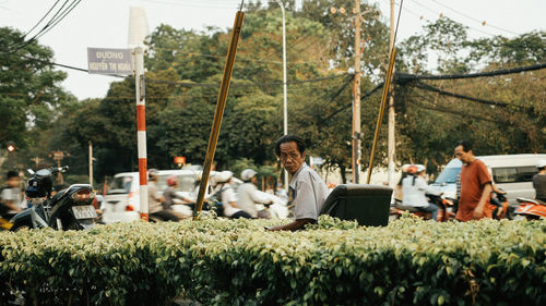 Group of people sitting on laptop