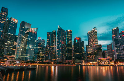 View of skyscrapers lit up at night