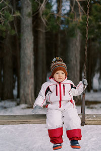 Portrait of boy standing in park