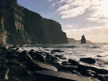 Scenic view of sea against cloudy sky