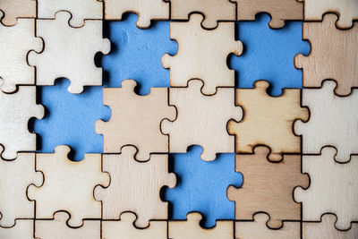 High angle view of wooden jigsaw puzzle