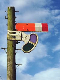 Low angle view of street light against sky