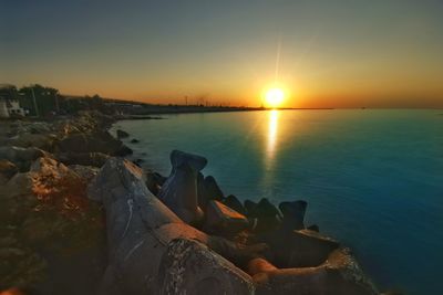 Scenic view of sea against sky during sunset