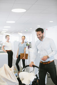 Man with buggy in office