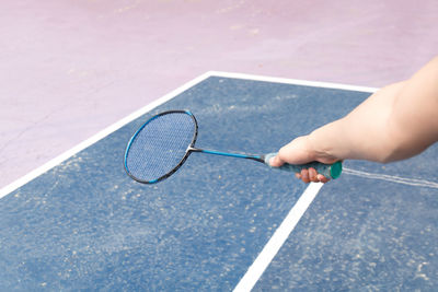 High angle view of man playing badminton