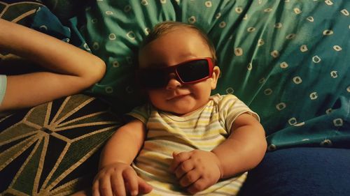 Directly above shot of baby boy wearing sunglasses