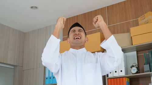 arms raised
