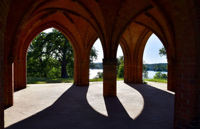 Trees seen through arch of building