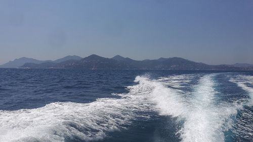 Scenic view of sea against clear blue sky