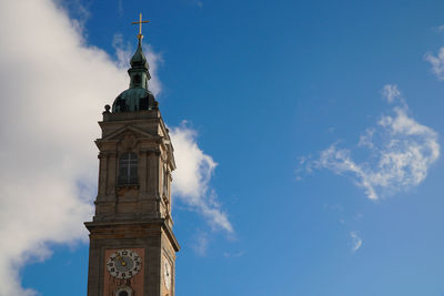 Low angle view of clock tower against sky