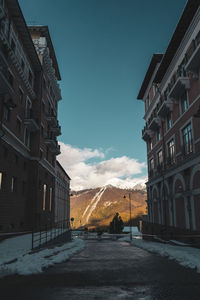 Stylized photo of a mountain town, view of the caucasus mountains