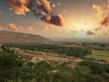 Scenic view of landscape against dramatic sky