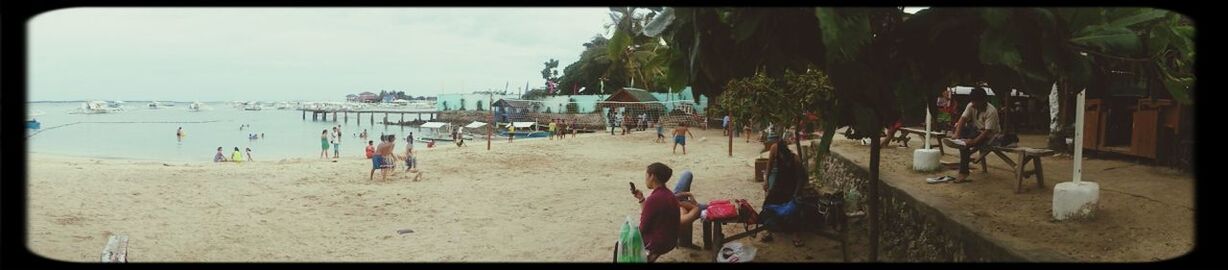 beach, sea, transfer print, sand, water, shore, auto post production filter, sky, horizon over water, vacations, panoramic, leisure activity, men, person, lifestyles, sunlight, large group of people, incidental people, day