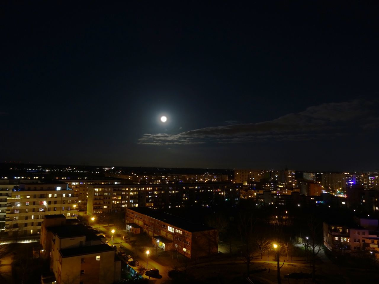 night, architecture, building exterior, moon, illuminated, city, built structure, cityscape, sky, building, evening, darkness, dusk, light, no people, nature, high angle view, full moon, city life, residential district, travel destinations, outdoors, horizon, urban skyline, dark, copy space, skyline