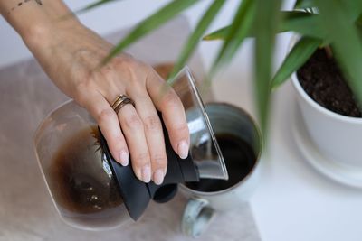 Midsection of woman holding drink