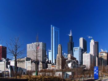 Low angle view of skyscrapers against clear sky