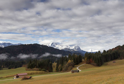 Scenic view of landscape and mountains against sky