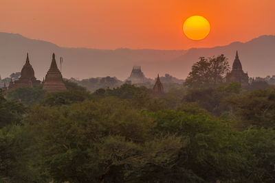 Scenic view of temple against sky during sunset