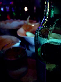 Close-up of wine glasses on table