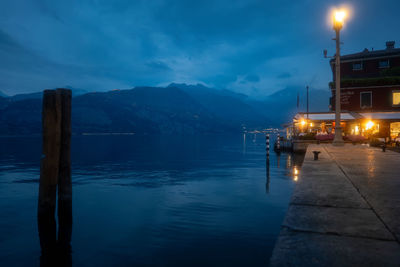 Scenic view of sea and mountains against sky during sunset