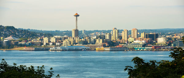 Panoramic view of buildings by sea in city